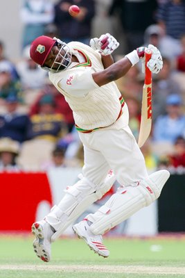Brian Lara ducks a bouncer