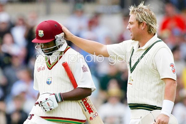 Brian Lara congratulated by Shane Warne