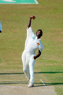 Muttiah Muralitharan of Sri Lanka bowls