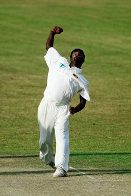 Muttiah Muralitharan of Sri Lanka bowls 