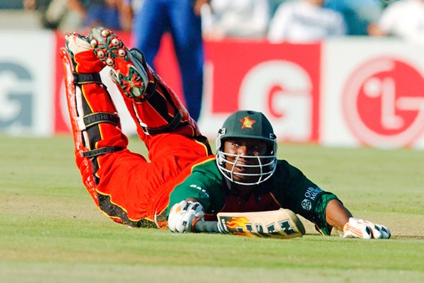 Tatenda Taibu of Zimbabwe dives to avoid being run out