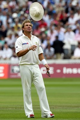 Shane Warne tosses his hat
