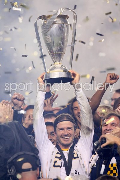 David Beckham lifts the 2011 MLS Cup 