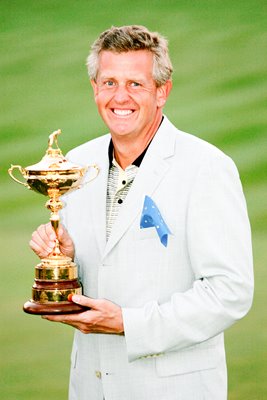 Colin Montgomerie holds the trophy 