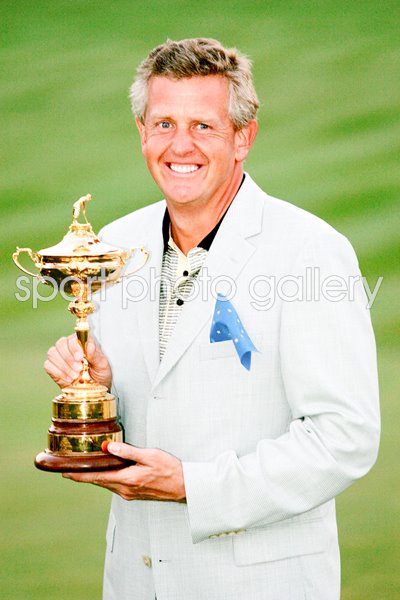 Colin Montgomerie holds the trophy 