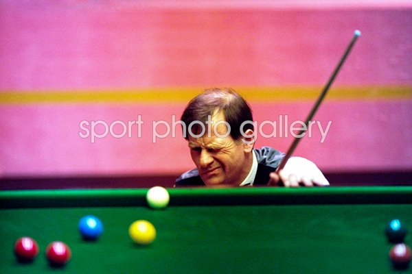 Alex Higgins of Ireland lines up a shot during the 1994 Embassy World Snooker Championships