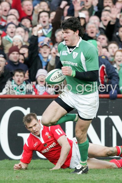 Shane Horgan goes past Dafydd James