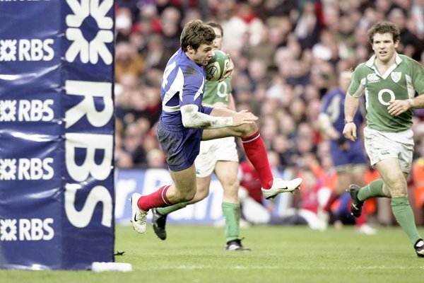 Vincent Clerc of France dives over to score