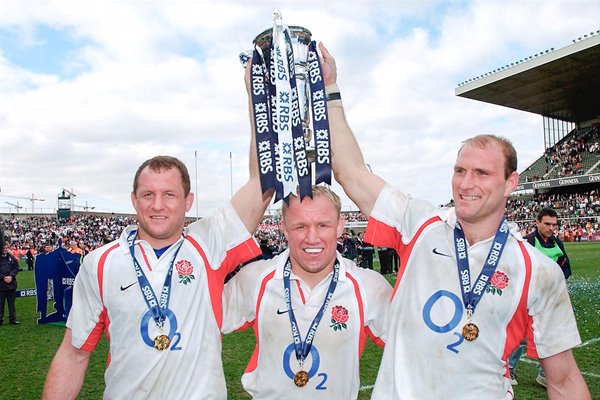 England's back row (l to r) Richard Hill, Neil Back and Lawrence Dallaglio celebrate after winning the Grand Slam