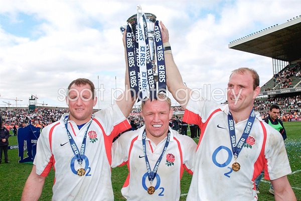 England's back row (l to r) Richard Hill, Neil Back and Lawrence Dallaglio celebrate after winning the Grand Slam