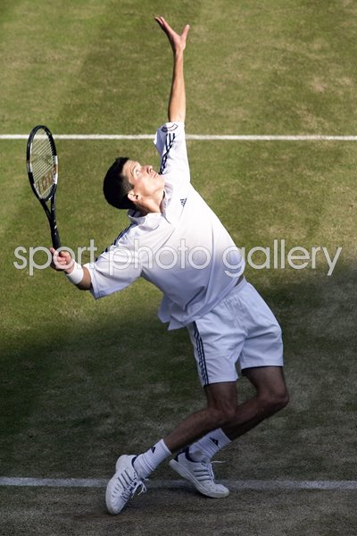 Tim Henman serves