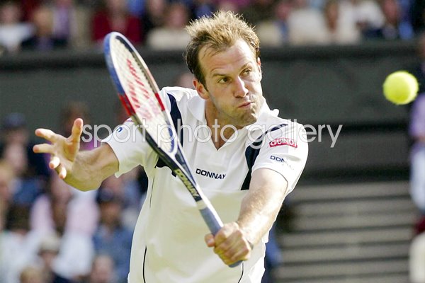 Greg Rusedski plays a backhand