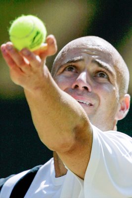 Andre Agassi serves