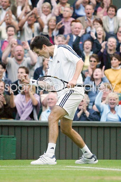 Tim Henman celebrates  
