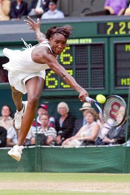 Venus Williams dives for a backhand