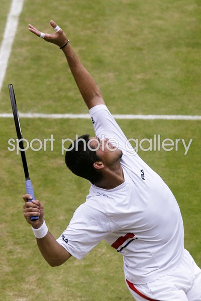 Mark Philippoussis serves