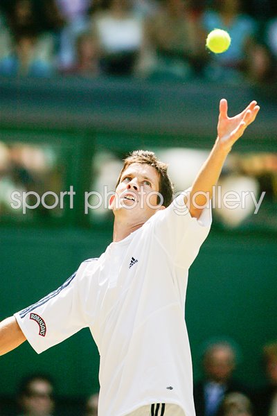Tim Henman serves
