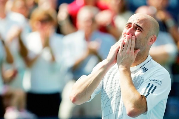 Andre Agassi blows kisses to the crowd 