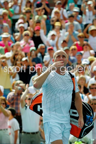 Andre Agassi blows kisses to the crowd 