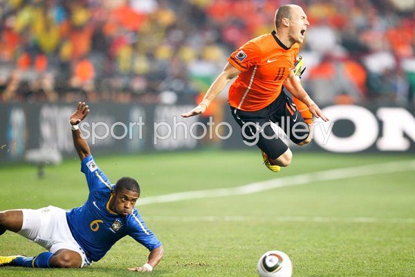 Arjen Robben dives over the Brazilian tackle