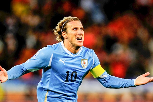 Diego Forlan celebrates his equalizer v Holland