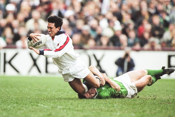 Tony Underwood of England (left) is tackled by Philip Danaher of Ireland
