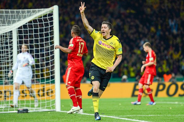 Robert Lewandowski celebrates scoring his third v Bayern Munich