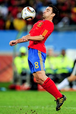 Xavi of Spain controls the ball