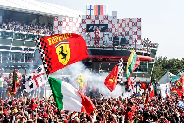 Italian fans celebarte Michael Schumacher win Monza 2006
