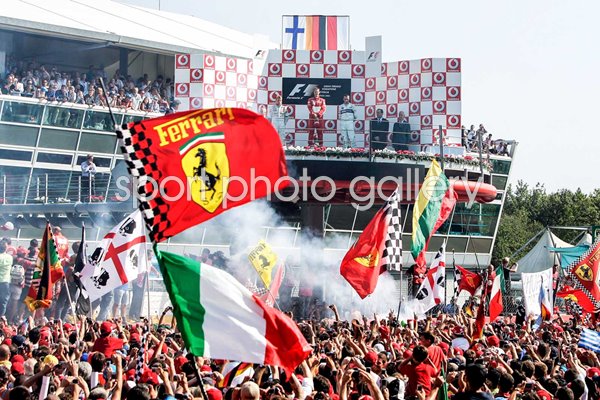 Italian fans celebarte Michael Schumacher win Monza 2006