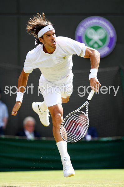 Feliciano Lopez Spain serves v Karen Khachanov Wimbledon 2019