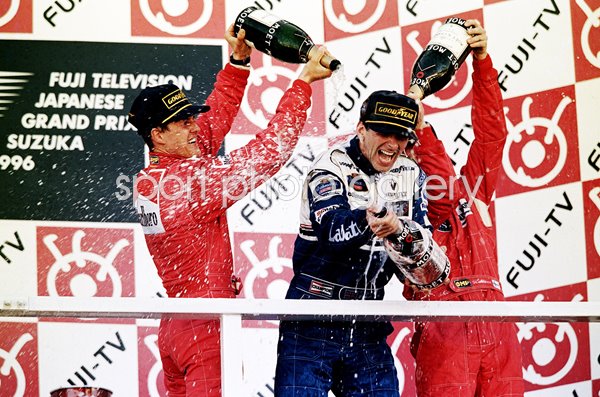 Damon Hill & Michael Schumacher Podium Champagne Celebration Japan 1996