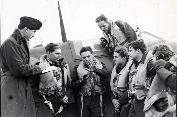 Photo shows:- Intelligence Officer Sir Michael Duff-Assheton-Smith Bt., whose Gt Grandfather was Secretary of State for War during the Crimea War, wtih pilots L to R. Sq Ldr R P R Powell (Penang, Straits Settlements) P/O Wm James Daley of Amarillo, Texas,