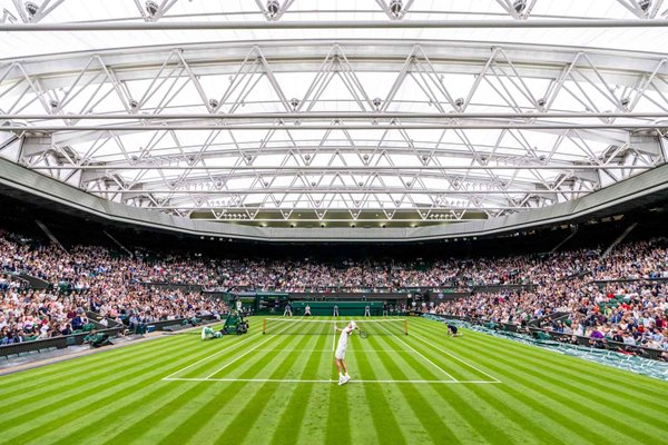 Jack Draper Great Britain serves v Novak Djokovic Wimbledon 2021