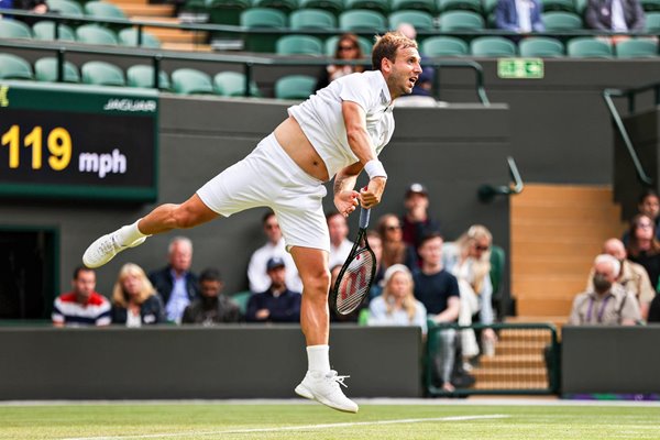 Dan Evans Great Britain serves v Dusan Lajovic Wimbledon 2021