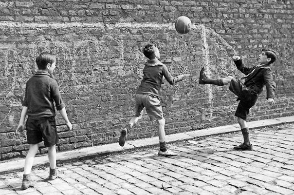Boys play street football in Salford 1938