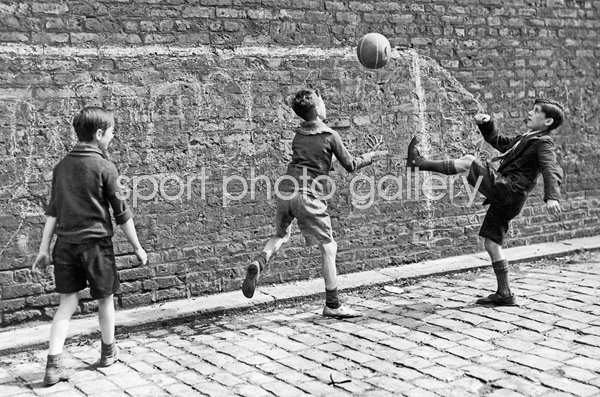 Boys play street football in Salford 1938