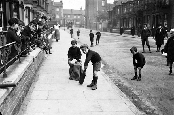 Boys play street cricket London 1926