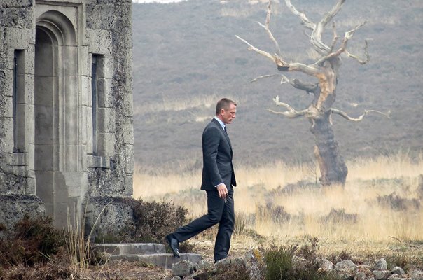 Daniel Craig departs Skyfall Lodge while filming as James Bond in on location in Surrey, UK