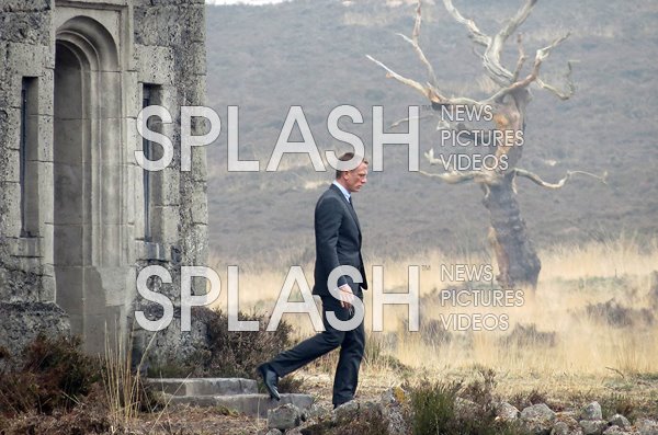 Daniel Craig departs Skyfall Lodge while filming as James Bond in on location in Surrey, UK