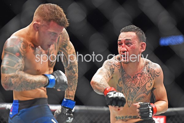 Max Holloway punches Dustin Poirier UFC 236 Atlanta 2019