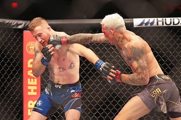 Charles Oliveira Brazil punches Justin Gaethje Phoenix UFC 274