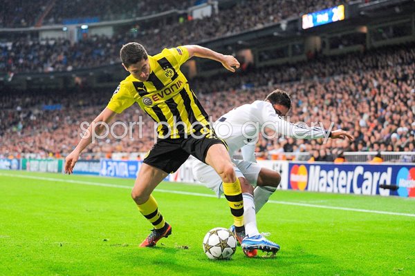 Robert Lewandowski of Borussia Dortmund battles the ball 