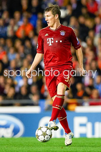 Bastian Schweinsteiger of Bayern Muenchen controls the ball 