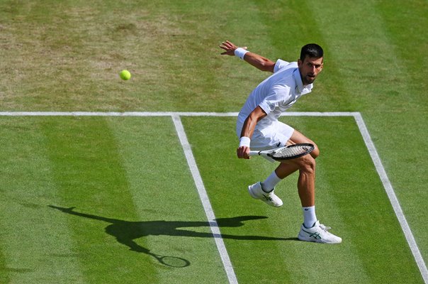 Novak Djokovic Serbia backhand balance v Jannik Sinner Wimbledon 2022