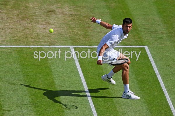 Novak Djokovic Serbia backhand balance v Jannik Sinner Wimbledon 2022