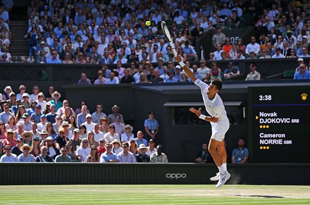 Novak Djokovic serves v Cameron Norrie Centre Court Wimbledon 2022