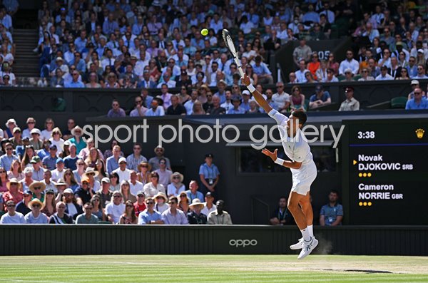 Novak Djokovic serves v Cameron Norrie Centre Court Wimbledon 2022