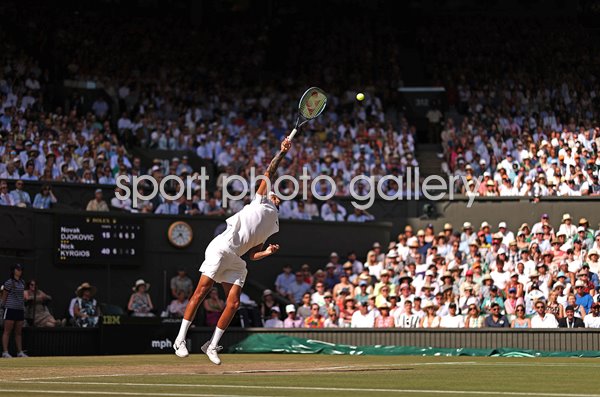 Nick Kyrgios serves v Novak Djokovic Centre Court Wimbledon 2022