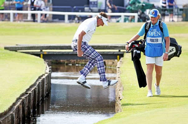 Ian Poulter England jumps the water hazard 1st Hole St Andrews 2022